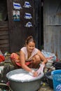 A couple living in a slum doing laundry